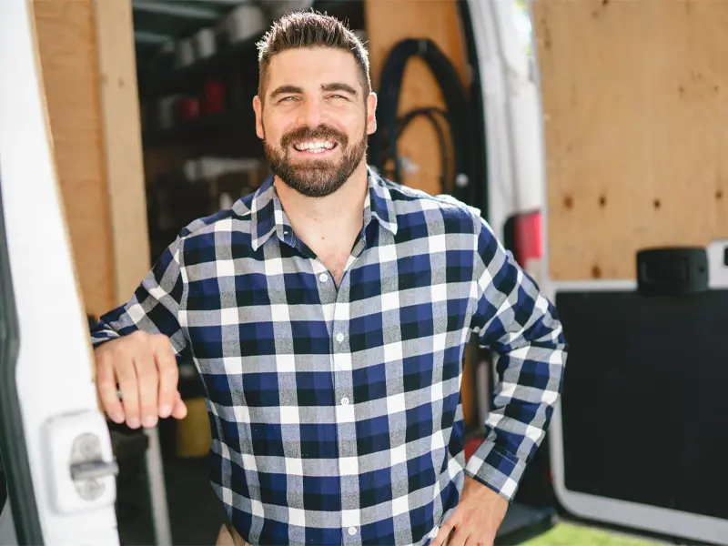 Portrait of a Louisville attic insulation expert next to his truck